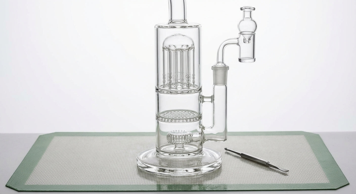 Close-up photo of a dab rig with three labeled percs: tree, honeycomb, showerhead