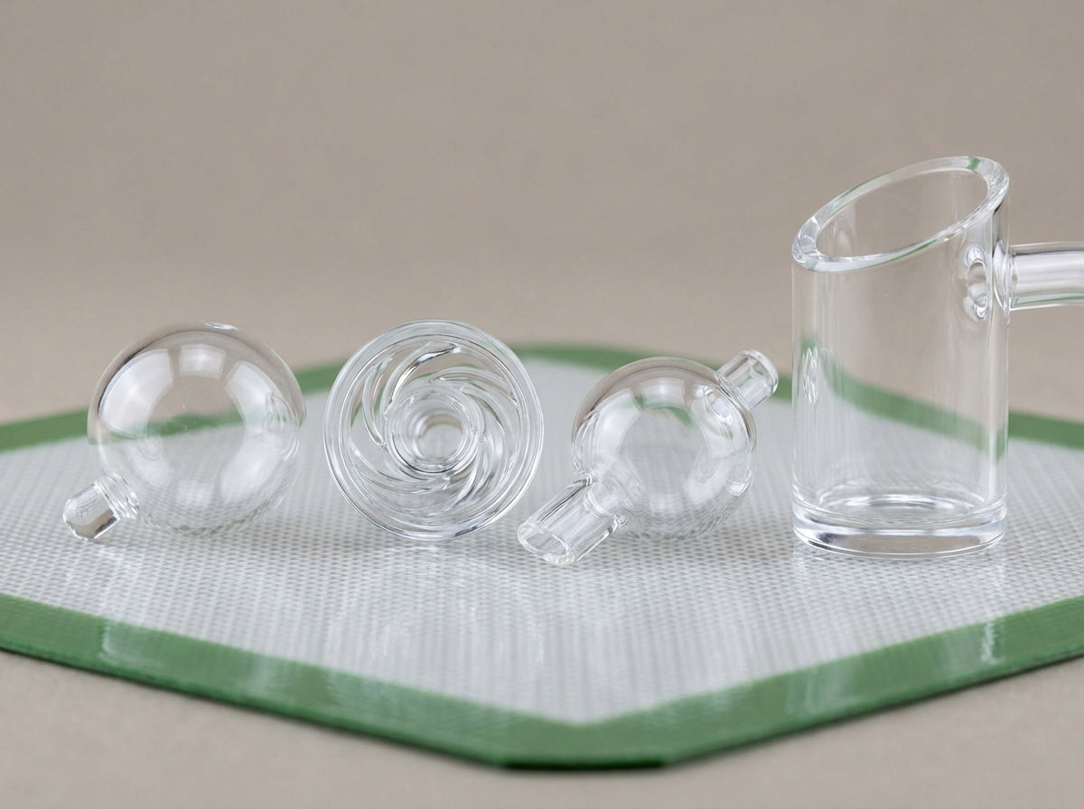 Close-up of three carb caps (bubble, spinner, directional) next to a quartz bucket banger