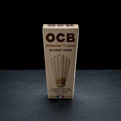 OCB Unbleached 1 ¼ Cones 50 Count Tower — Oil Slick editorial product photo