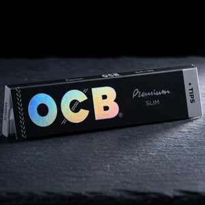 OCB Premium Slim Papers + Tips — Oil Slick editorial product photo