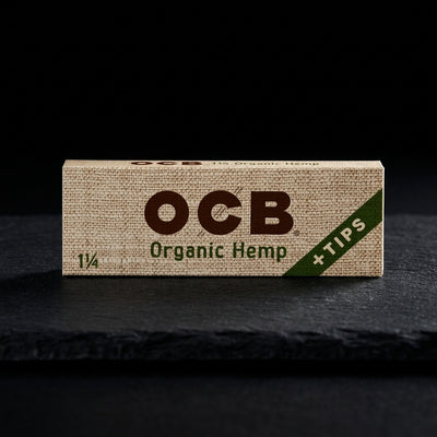 OCB Organic Hemp 1 ¼ Papers + Tips — Oil Slick editorial product photo