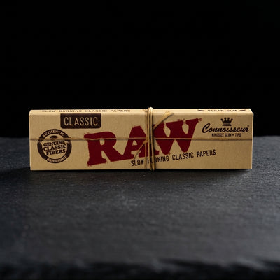 RAW Classic King Size Connoisseur with Tips Rolling Papers 24bx — Oil Slick editorial product photo