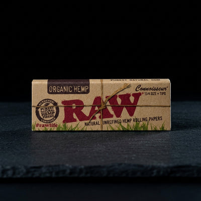 RAW Organic Connoisseur 1 ¼ Rolling Papers with Tips 24bx — Oil Slick editorial product photo