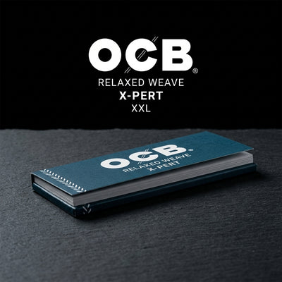 OCB X-Pert XXL Rolling Papers — Oil Slick editorial product photo