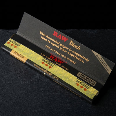 RAW Black Classic King Size Slim Rolling Papers — Oil Slick editorial product photo