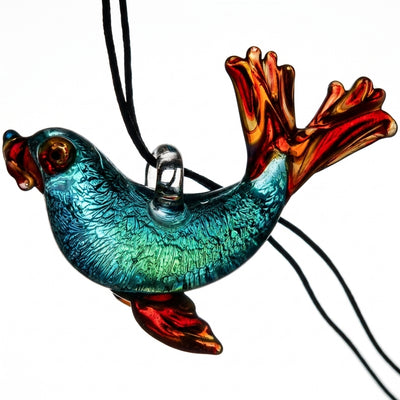 2.25" Peaselburg Dichro Seal Pendant on dark slate surface - Oil Slick Pad