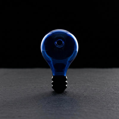 2.5" Color Light Bulb Orb Carb Cap on dark slate surface - Oil Slick Pad