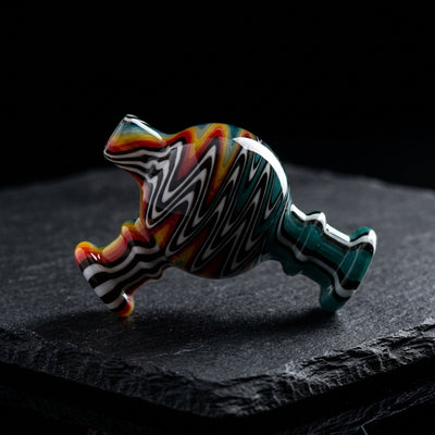 2.5″ Wigwag Maria Top Ball Carb Cap on dark slate surface - Oil Slick Pad