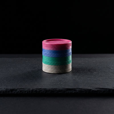 2″ Biodegradable Grinder on dark slate surface - Oil Slick Pad