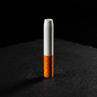 2'' Ceramic Cigarette Chillum on dark slate surface - Oil Slick Pad