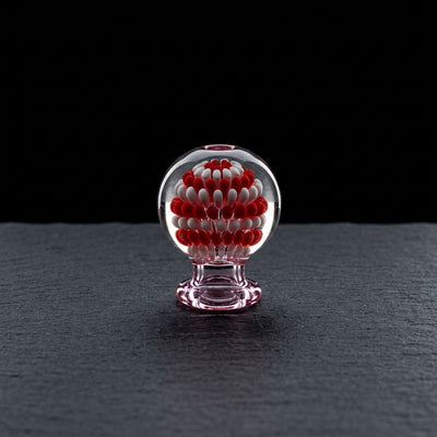2″ Color Dot Implosion Carb Cap on dark slate surface - Oil Slick Pad