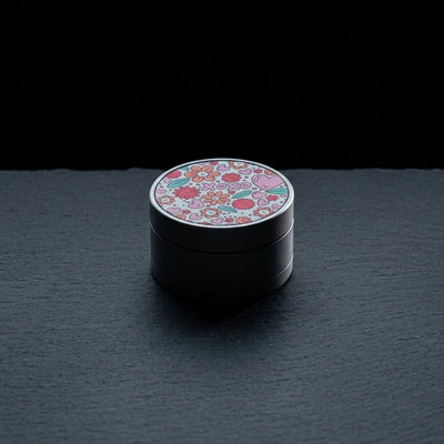 2" Love You Forever Grinder - 1 on dark slate surface - Oil Slick Pad