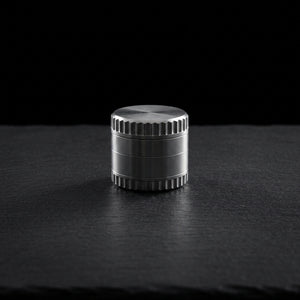 2″ Notched Zinc Grinder on dark slate surface - Oil Slick Pad