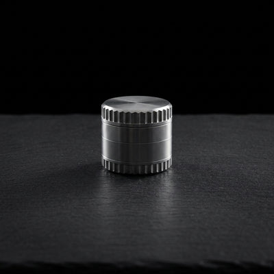 2″ Notched Zinc Grinder on dark slate surface - Oil Slick Pad