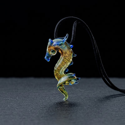 2" Peaselburg Dichro Dragon Pendant on dark slate surface - Oil Slick Pad