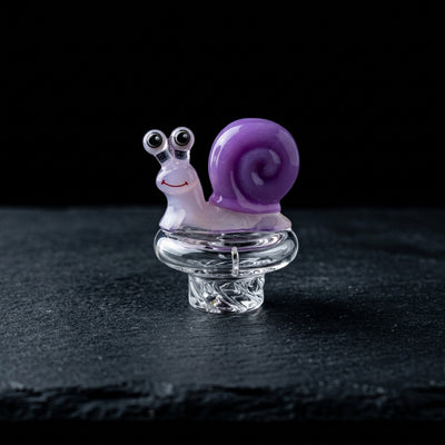 2" Snail Spinner Carb Cap on dark slate surface - Oil Slick Pad