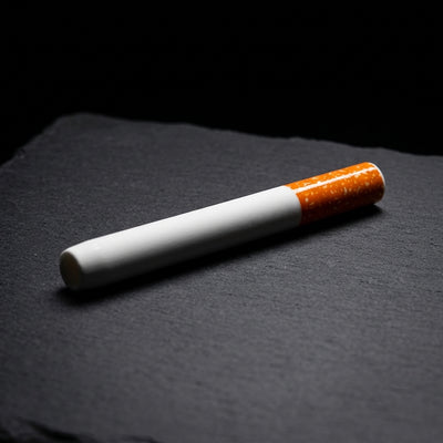 3'' Ceramic Cigarette Chillum on dark slate surface - Oil Slick Pad