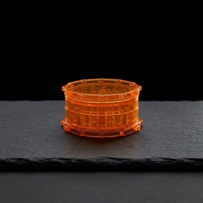 3" Plastic Grinder - 1 on dark slate surface - Oil Slick Pad
