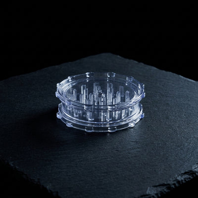 3" Plastic Grinder on dark slate surface - Oil Slick Pad