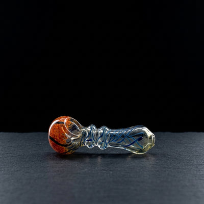 4.5" Frit Head Clear Body w/ Line Twist Flat Mouth Hand Pipe on dark slate surface - Oil Slick Pad