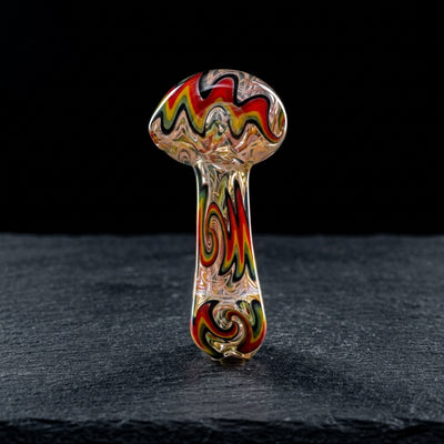 4.5" Rasta Wigwag w/ Fume Line Wiggy Between Hand Pipe on dark slate surface - Oil Slick Pad