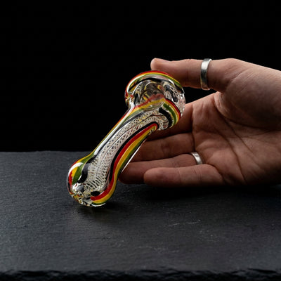 4.5" Super Thick Rasta Line w/ Twisted Cane Hand Pipe on dark slate surface - Oil Slick Pad
