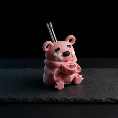 4.9'' Tongue-sticking bear water pipe on dark slate surface - Oil Slick Pad