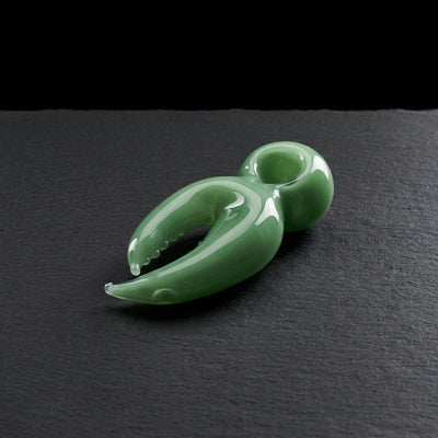 4″ Crab Claw Glass Hand Pipe on dark slate surface - Oil Slick Pad