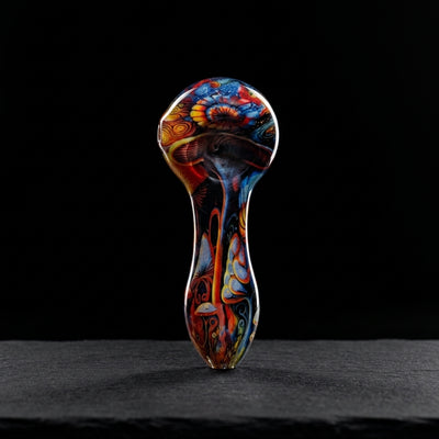 4″ Decal Wrap Hand Pipe on dark slate surface - Oil Slick Pad