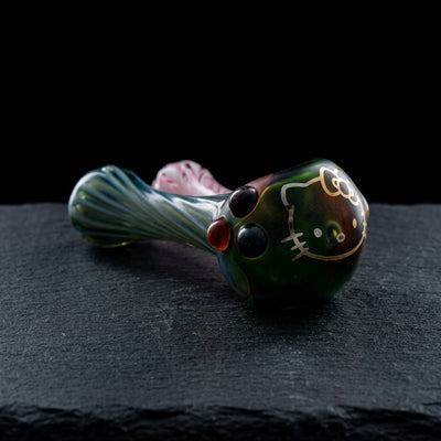 4" Element Hello Kitty Hand Pipe - Made in USA on dark slate surface - Oil Slick Pad