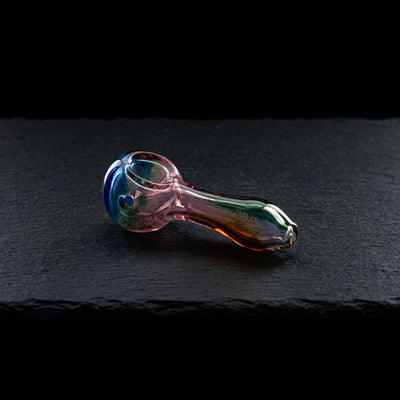 4" Full Color Glass Hand Pipe on dark slate surface - Oil Slick Pad