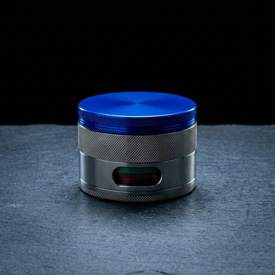 4" Large Zinc Grinder on dark slate surface - Oil Slick Pad