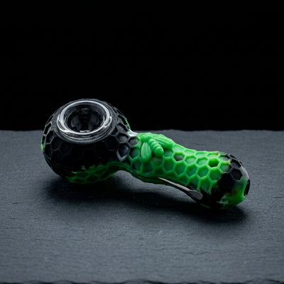 4″ Silicone Honeycomb Spoon w/ Poker on dark slate surface - Oil Slick Pad