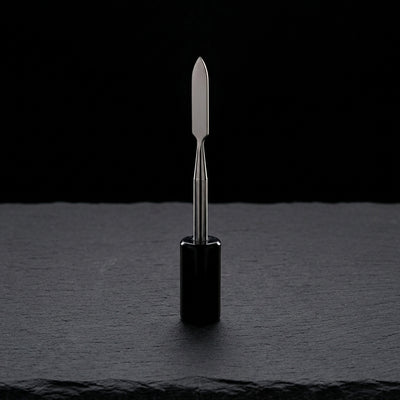 4″ Stainless Steel & Resin Dab Tool on dark slate surface - Oil Slick Pad