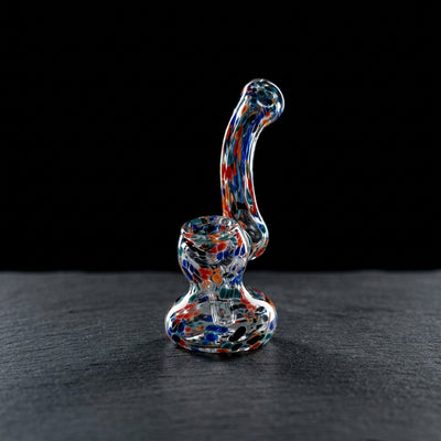 4.5″ Confetti Glass Bubbler on dark slate surface - Oil Slick Pad