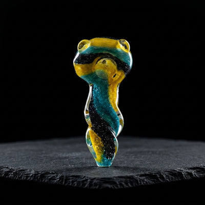 4.5″ Spiral Glass Hand Pipe on dark slate surface - Oil Slick Pad