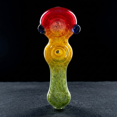 5.5" Rasta Frit Double Bowl Hand Pipe on dark slate surface - Oil Slick Pad