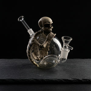 5.8'' pvc skull water pipe on dark slate surface - Oil Slick Pad