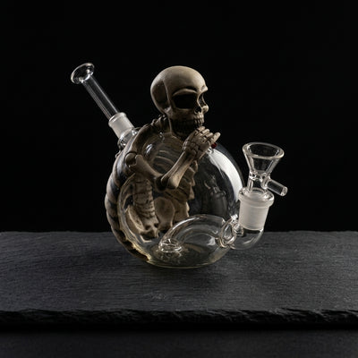5.8'' pvc skull water pipe on dark slate surface - Oil Slick Pad