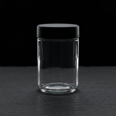 5 Oz Glass Jar w/ Black Cr Lid on dark slate surface - Oil Slick Pad