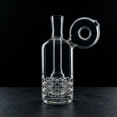 5.5″ Triple Ratchet Donut Mouth Rig on dark slate surface - Oil Slick Pad