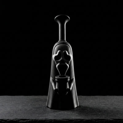 6.5" Scream Silicone Bong on dark slate surface - Oil Slick Pad