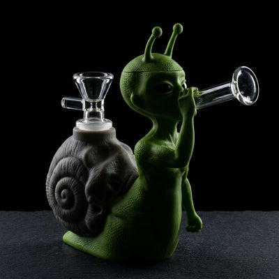 6.6" Snail alien water pipe on dark slate surface - Oil Slick Pad