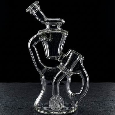 6″ Monark Clear Mini Floating Rig on dark slate surface - Oil Slick Pad