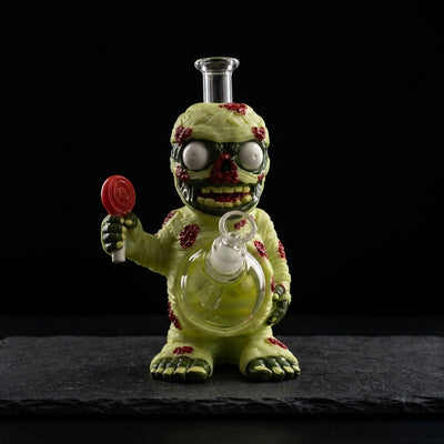 7.29" Lollipop mummy water pipe on dark slate surface - Oil Slick Pad