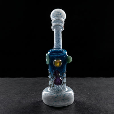 7.5″ Color Frit w/ Critter & Mushroom Implosion Glass Bubbler on dark slate surface - Oil Slick Pad