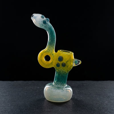 7.5″ Frit Donut Mushroom Implosion Glass Bubbler on dark slate surface - Oil Slick Pad