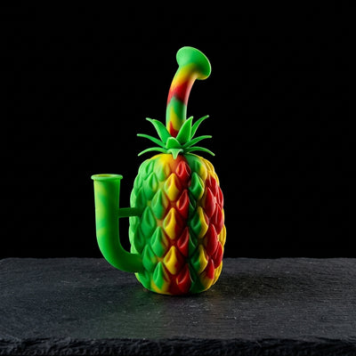 7″ Silicone Pineapple Rig on dark slate surface - Oil Slick Pad
