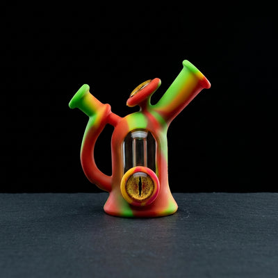 7″ Silicone Window Bottle w/ Cat Eye Rig on dark slate surface - Oil Slick Pad