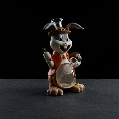 8.6" Grateful rabbit water pipe on dark slate surface - Oil Slick Pad